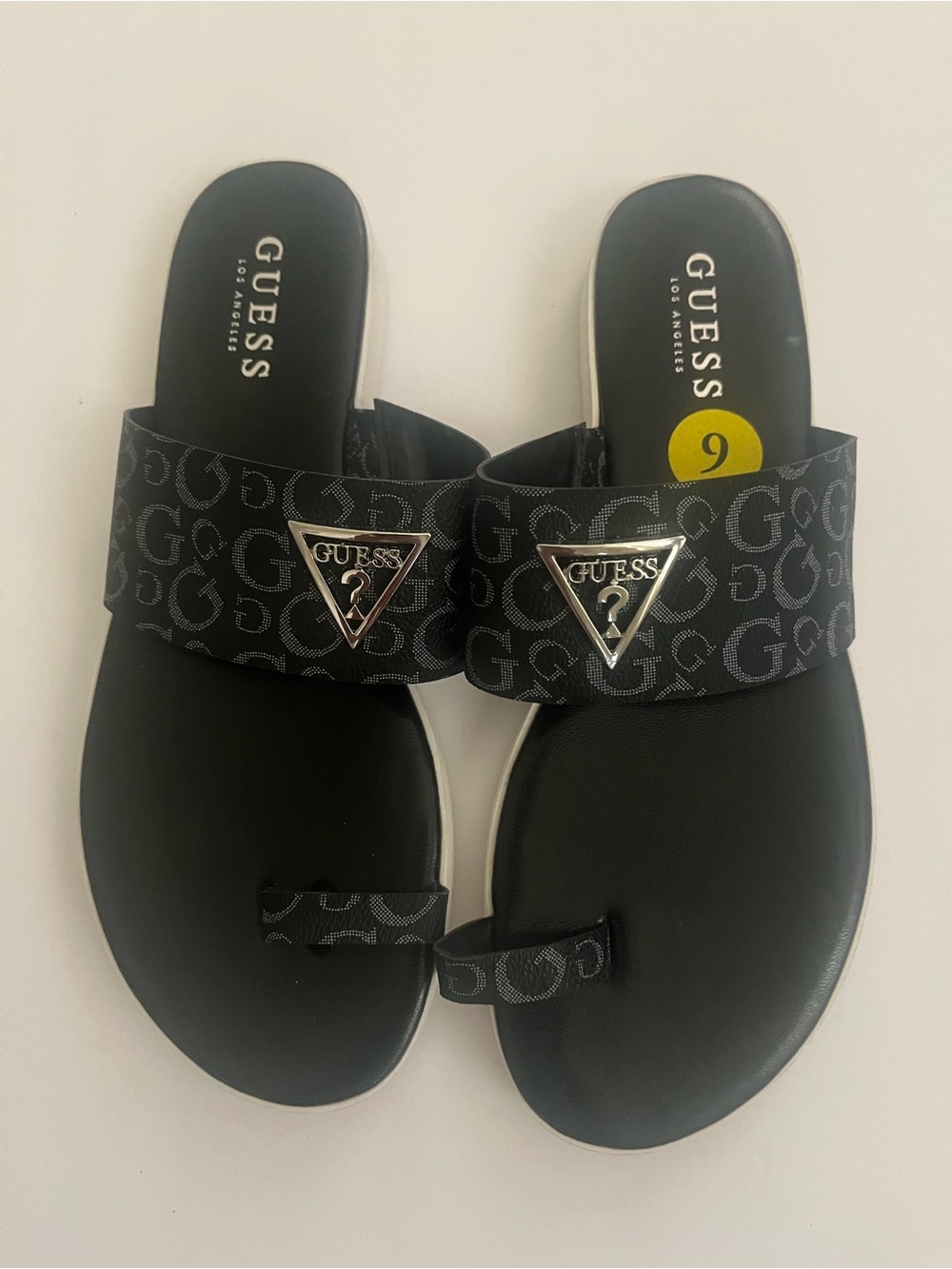 Guess Black Logo Toe-Loop Sandals with Silver Triangle Emblem
